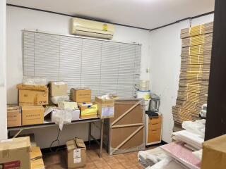 Room used for storage with boxes and packing materials