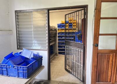 Storage room with shelves and plastic bins