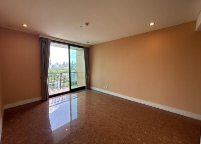 Spacious and well-lit living room with city view