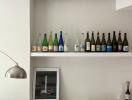 Living room with decorative bottles and art