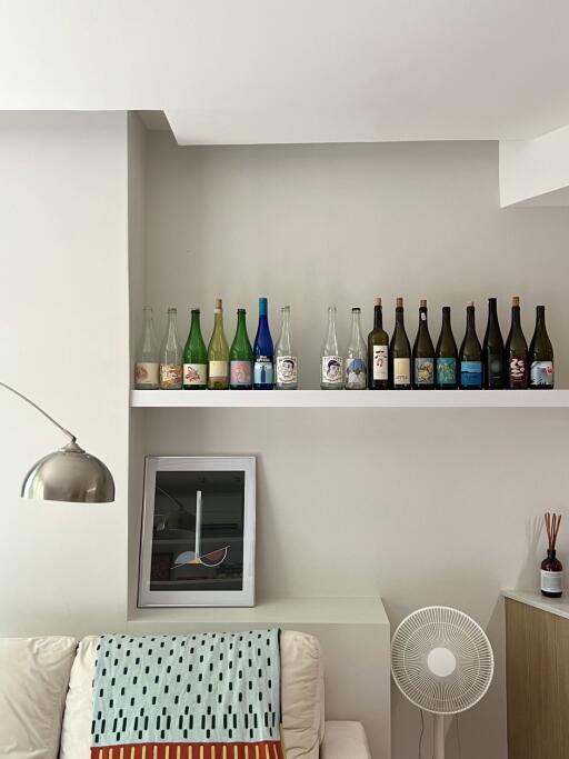 Living room with decorative bottles and art