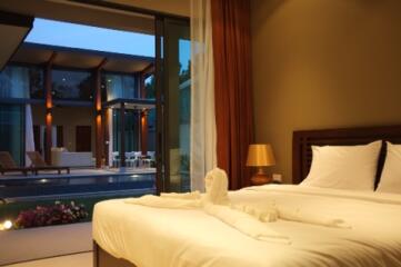 Bedroom with a view of the pool and modern outdoor area