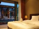 Bedroom with a view of the pool and modern outdoor area