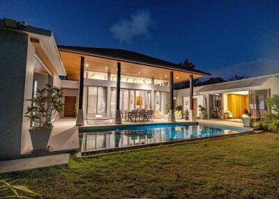 Modern house with outdoor pool at night