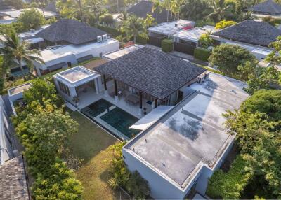 Aerial view of a modern residential property with a pool