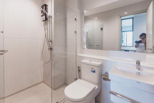 Modern bathroom with glass shower and white fixtures