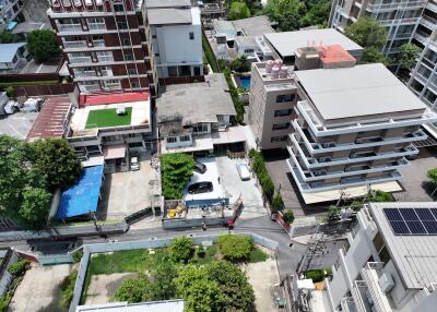 Aerial view of residential buildings and parking area