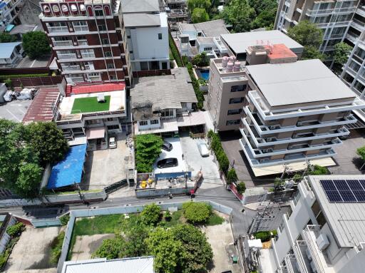 Aerial view of residential buildings and parking area