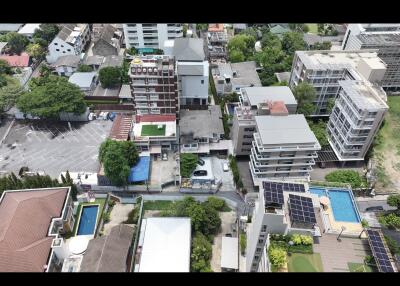 Aerial view of a residential neighborhood with various buildings and amenities