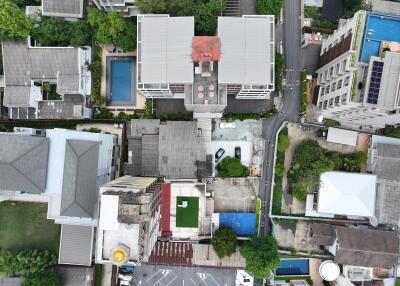Aerial view of a residential area with multiple buildings and amenities