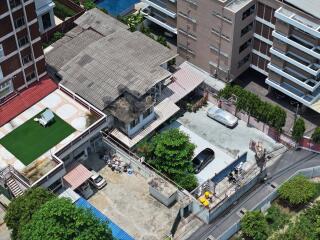 Aerial view of residential buildings and surrounding area