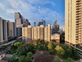 Cityscape view from high-rise building balcony