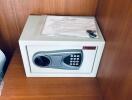 Hotel room safe in a wooden closet