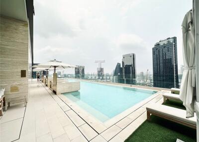 Modern rooftop pool with city skyline view