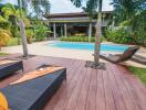 Outdoor area with pool and lounge chairs