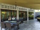 Outdoor patio area with table and chairs