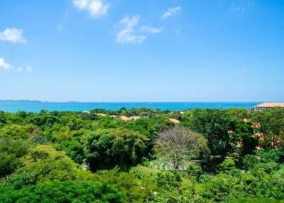 Scenic view from the property with lush greenery and ocean in the background