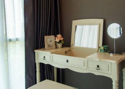 Vanity table with stool in a bedroom
