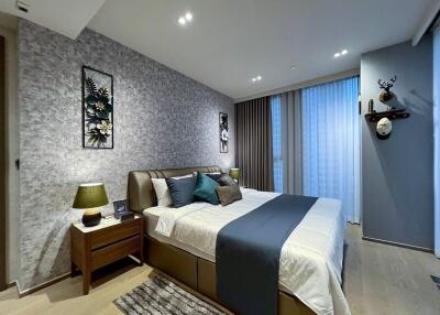 Modern bedroom with decorated walls and double bed