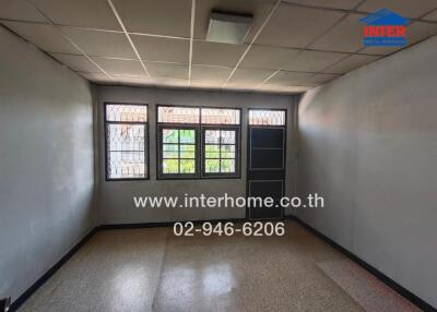 Empty room with window and tiled floor