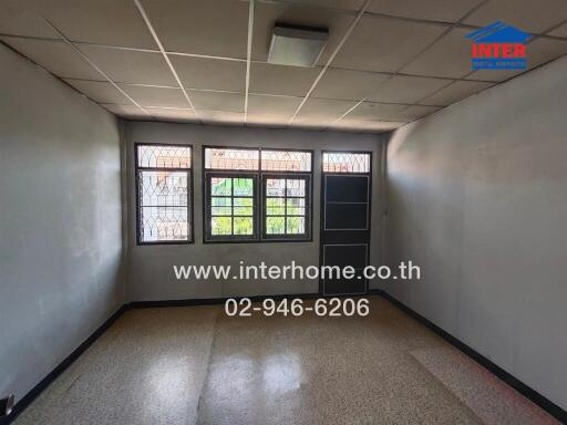 Empty room with window and tiled floor