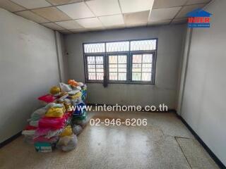 Unfurnished room with windows