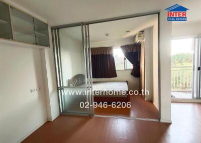 Bedroom with sliding glass door and balcony access