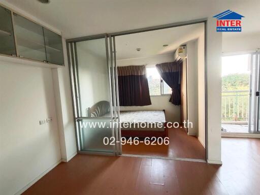 Bedroom with sliding glass door and balcony access