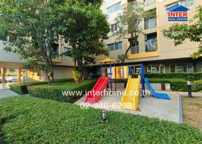 Outdoor area with playground in front of a residential building