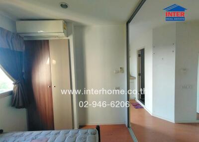 Small bedroom with a window, curtain, air conditioner, fitted wardrobe, and sliding mirror door