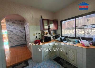 Spacious kitchen with ample counter space and cabinets