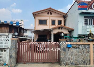 Two-story residential house with gate