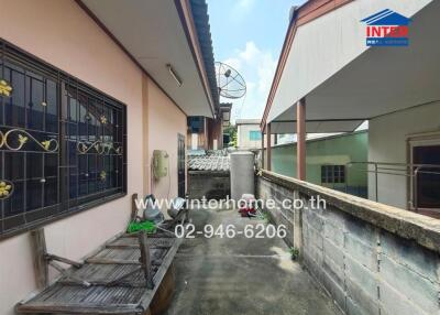 Outdoor area with satellite dish and wooden bench