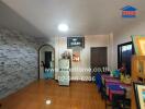 Dining area with wooden flooring and wall decor