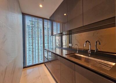 Modern kitchen with sleek cabinetry and stainless steel fixtures