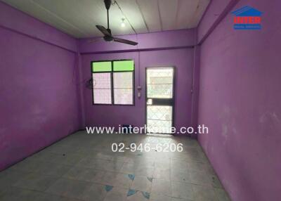 Unfurnished room with purple walls