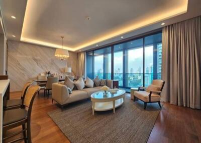 Spacious modern living room with a large glass window and city view