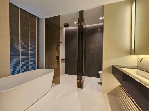 Modern bathroom with a freestanding bathtub and glass-enclosed shower