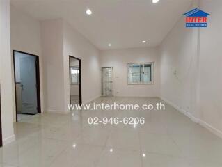 Spacious main living area with tiled floors and large windows