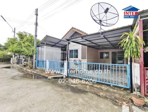 Exterior view of a residential house with a satellite dish