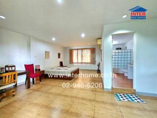 Spacious bedroom with bathroom and seating area