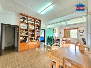 Spacious living room with wooden furniture and built-in display shelf