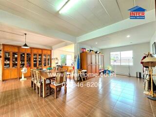 Spacious open-plan living and dining area with large windows