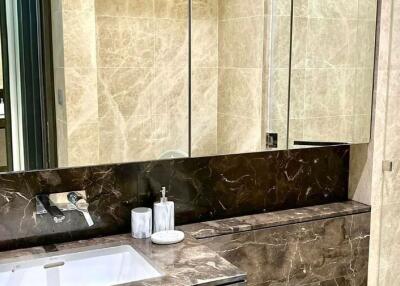 Contemporary bathroom with marble finish and modern fixtures