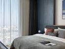 Modern bedroom with large window and city view