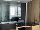 Modern bathroom with glass shower and built-in desk