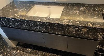 Modern bathroom sink with granite countertop