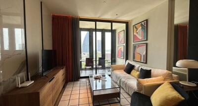 Modern living room with large windows and balcony