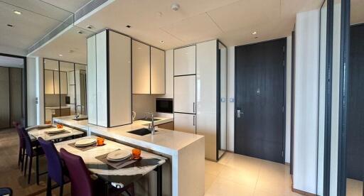 Modern kitchen with dining area and marble countertops