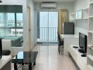 Modern living room with a balcony and plenty of natural light